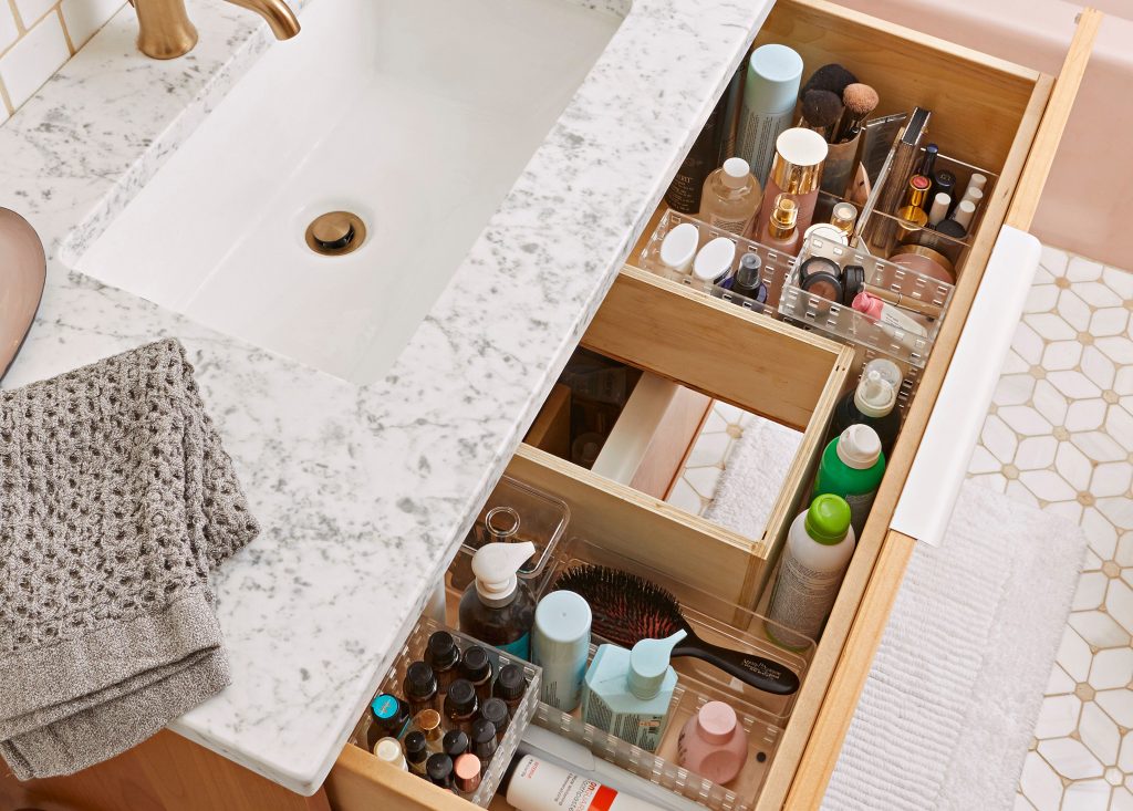 bathroom drawer with makeup and beauty products